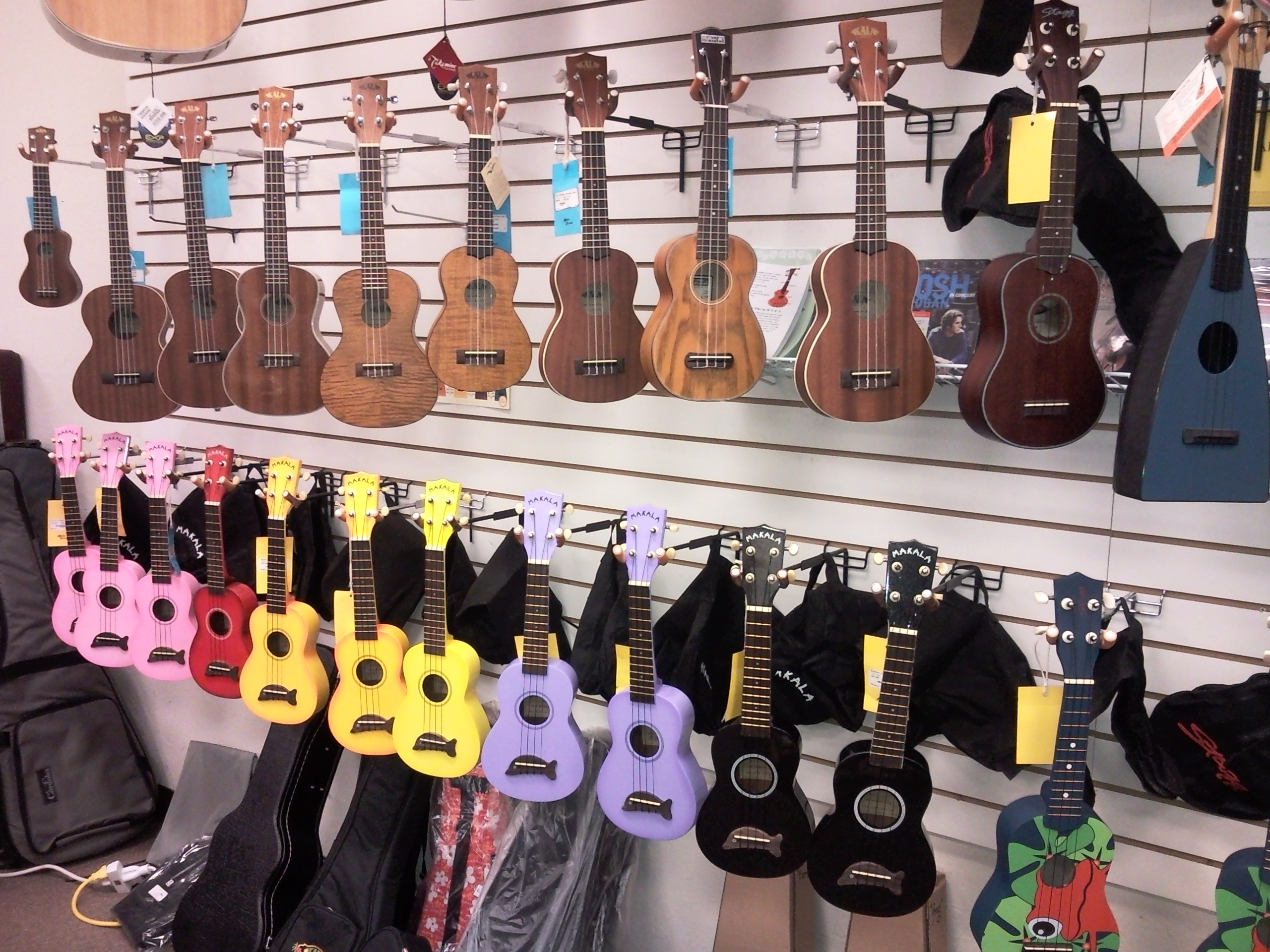 The corner of our store with Ukuleles, showing our different ukulele brands, including Kala, Cordoba, Makala, and Riptide.